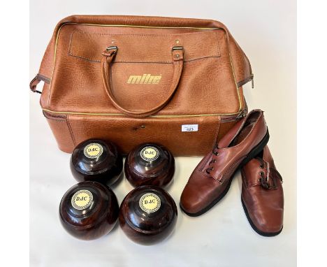 A set of four lawn bowls, likely made of Lignum Vitae wood, crafted by George Mackay of Edinburgh. To include leather Mitre c