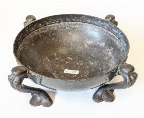 Oliver Baker, Liberty &amp; Co, An art nouveau Pewter bowel of circular outline and raised on four reeded and stylised trefoi