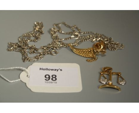A pendant in the form of a pair of balance scales, set with diamonds to balance pans, stamped 750, a dagger tie tack and two 