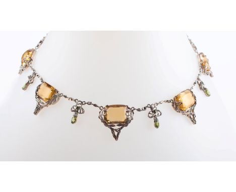 An Arts and Crafts silver, citrine and periodot necklace, in the manner of Bernard Instone, the wirework fringe necklace inte