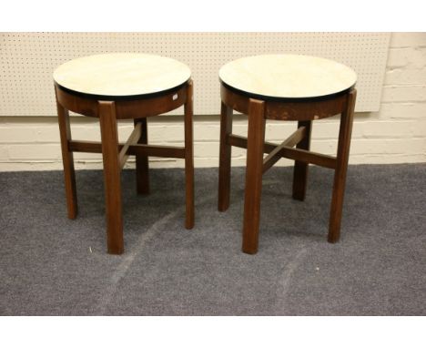 A pair of early 20th century circular formica top oak and ply lamp tables, 50cm diameter