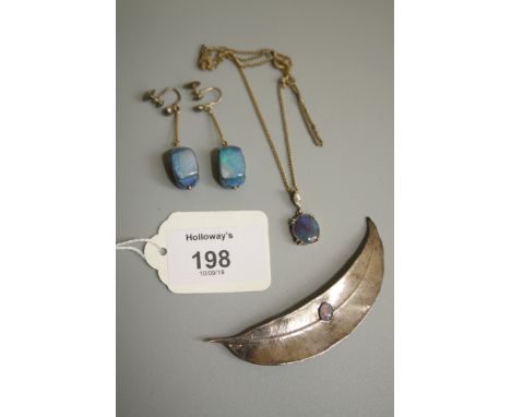 An opal pendant, the oval doublet in clear mount, an opal set feather brooch and a pair of panelled opal pendant earrings