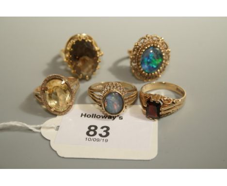 A single stone opal ring, in 9ct gold mount, another in filigree mount, a single stone garnet ring, a single stone citrine ri