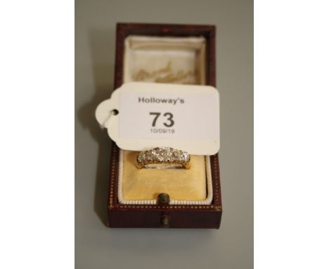 An Edwardian five stone half hoop ring, the graduated old cushion cut diamonds in carved 18ct gold claw mount, mixed cut ston