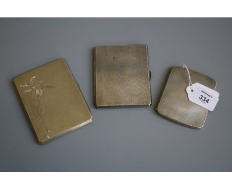 A 1940s silver engine turned cigarette case by Asprey of London, Birmingham 1946, together with two other cigarette cases, 14