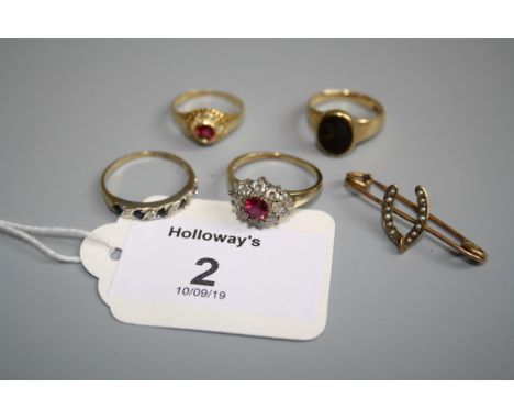 A ruby and diamond cluster ring, a sapphire and diamond half hoop eternity ring, an 18ct gold signet ring, a paste ring and a