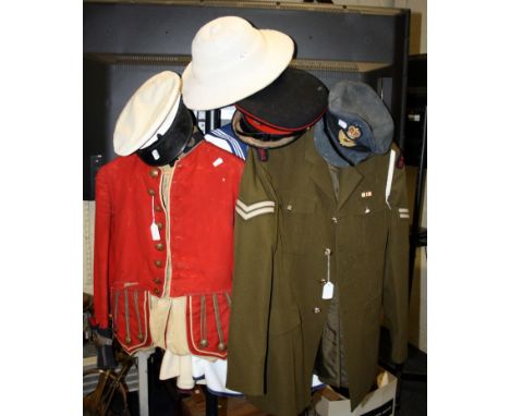 A collection of vintage miliary uniforms, including a probably late Victorian Queens Own Cameron Highlanders dress doublet, a