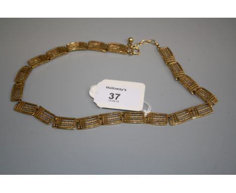 A 9ct gold necklace of gate link style, curved panels, 46cm length, cased 25.6g