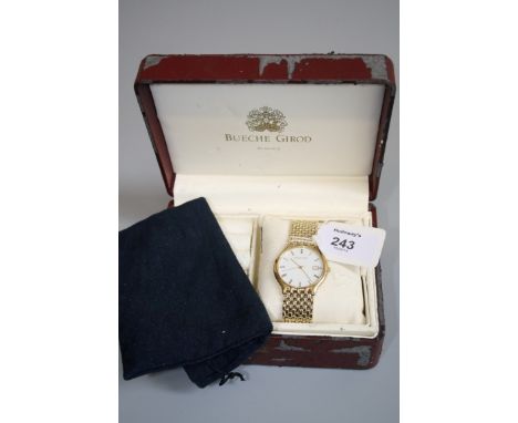 Beuche Girod. A gentleman's 9ct gold wristwatch, the circular white enamel dial with Roman numerals, date adjust at three o'c