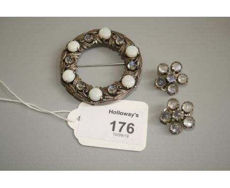 An Arts and Crafts opal and moonstone wreath brooch, attributed to Bernard Instone, set with circular opals and smaller circu