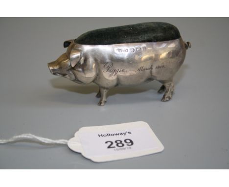 A probably Edwardian silver novelty pin cushion, in the form of a rotund pig, bearing the inscription 'Piggie March 1914' Bir