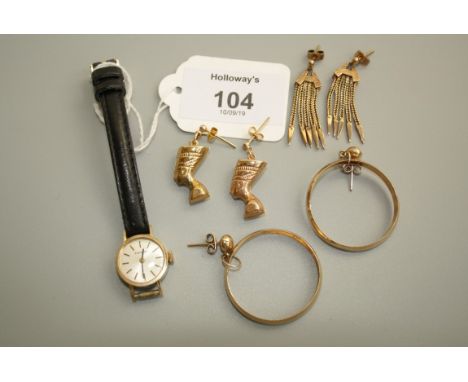 Tissot, a lady's 9ct gold wristwatch with baton numerals and champagne dial, together with three pairs of gold earrings, 11.5
