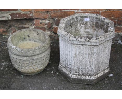 An octagonal reconstituted stone garden planter and another with trellis detail, 41 x 42cm (the largest)