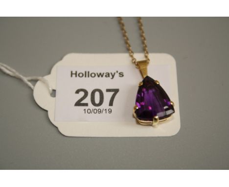 A single stone amethyst pendant, the triangular pendant in five claw mount, to a trace link chain