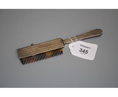 An early 20th century silver cased propelling comb, with engine turned decoration and faux tortoiseshell teeth, import marks,