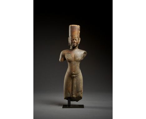 A SANDSTONE FIGURE OF VISHNU, PRE-ANGKOR PERIODKhmer Empire, 7th-8th century. The face meditative and smiling serenely, the a
