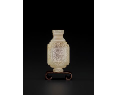 A WHITE AND RUSSET JADE MINIATURE ARCHAISTIC VASE, LATE MING TO MID-QINGChina, 17th-18th century. Finely carved and hollowed 