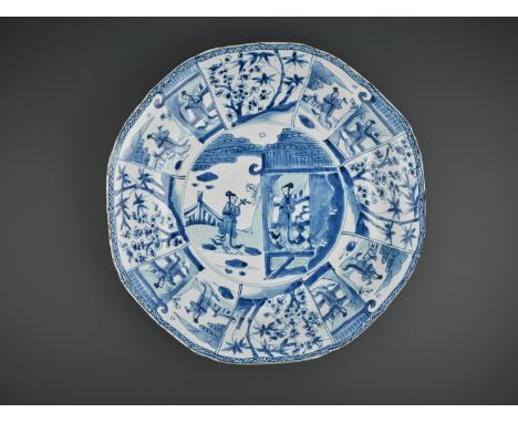A LARGE BLUE AND WHITE OCTAGONAL LOBED DISH, KANGXI PERIODChina, 1662-1722. The shallow sides rising from a tapering foot to 