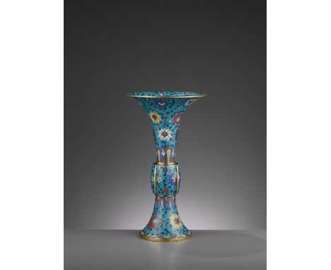 A LARGE CLOISONNE AND GILT-BRONZE GU, QING DYNASTYChina, 1750-1850. The tall beaker vase following an archaic bronze Gu form 