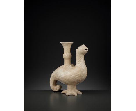 A WHITE-GLAZED ‘PHOENIX’ INCENSE HOLDER, LIAO TO YUAN DYNASTYChina, 10th-14th century. Molded in the form of a phoenix surmou