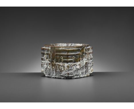 A BROWN JADE CONG, LIANGZHU CULTUREChina, Late Neolithic, c. 3300-2200 BC. Of cylindrical form with square projections on fou