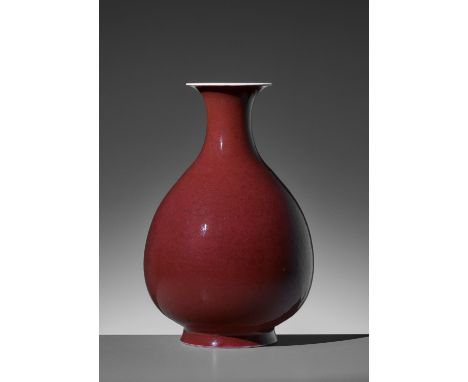 A COPPER-RED VASE, YUHUCHUNPING, QIANLONG MARK AND PERIODChina, 1735-1796. Superbly potted, the generously swelling body tape