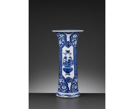 A BLUE AND WHITE ‘FLORAL’ BEAKER VASE, KANGXIKangxi period, 1662-1722.&nbsp;Of slightly waisted cylindrical form, painted wit
