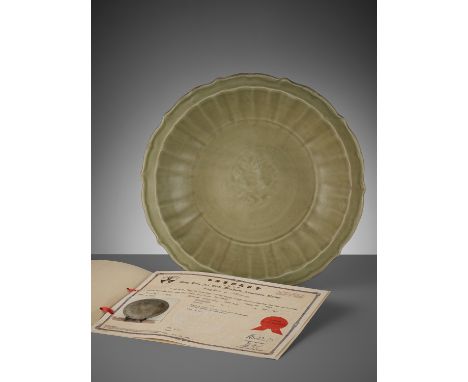 A LOBED LONGQUAN CELADON-GLAZED BARBED-RIM CHARGER, MINGChina, 1368-1644. The shallow lobed sides rising from a short ring fo