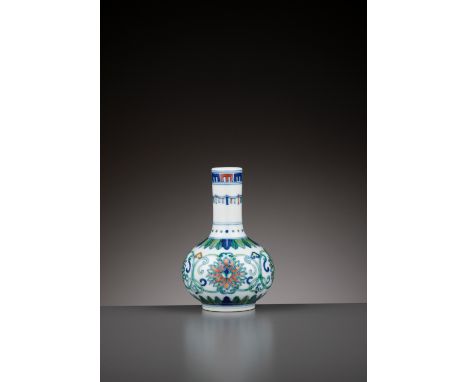 A DOUCAI MINIATURE ‘LOTUS’ VASE, YONGZHENG MARK AND PERIODChina, 1723-1735. Delicately potted with a slightly compressed glob