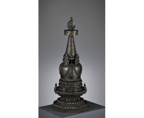 A LARGE AND MASSIVE ‘FOUR BUDDHA’ DIRECTIONAL BRONZE STUPA, QINGTibetan-Chinese, 18th-19th century. Supported on an octagonal