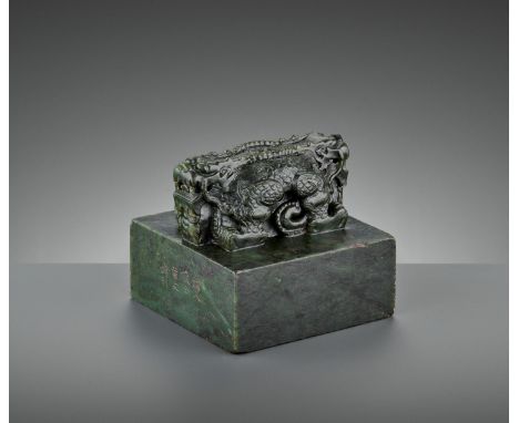 AN IMPERIAL ‘DOUBLE DRAGON’ SPINACH-GREEN JADE SEAL, THE SEAL FACE INSCRIBED IN MANCHU AND CHINESEChina, 18th century. Of lar