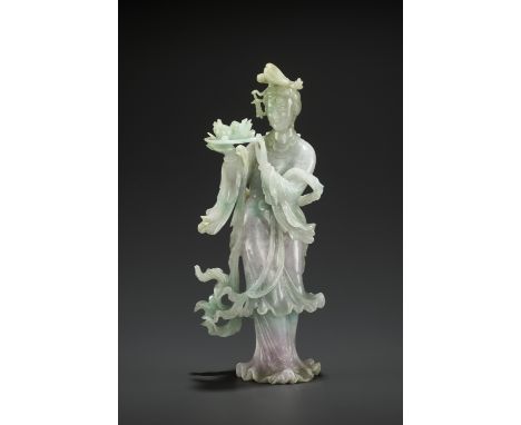 A ‘SANDUO’ LAVENDER JADEITE FIGURE OF A MEIREN, LATE QING TO REPUBLICChina, 1830-1930. Carved striding, she wears a long flow