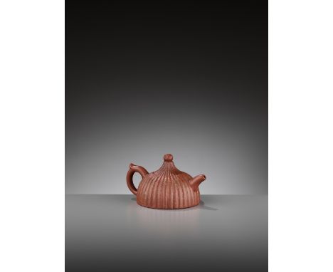 A YIXING ‘CHRYSANTHEMUM’ LOBED TEAPOT, REPUBLIC PERIODChina, 1912-1949. The half-spherical body with many lobes reminiscent o