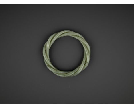 A CELADON JADE ROPE-TWIST BANGLE, QINGChina, 19th century. This lot is composed of three strands twisted together and particu