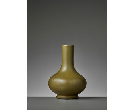 A TEADUST-GLAZED BOTTLE VASE, QIANLONG MARK AND PERIODChina, 1735-1796. The compressed globular body rising from a slightly w