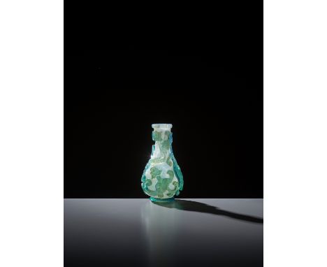 AN AQUAMARINE OVERLAY ‘CHILONG’ MINIATURE VASE, YUHUCHUNPING, QINGChina, 18th century. The pear-shaped body rising from the b
