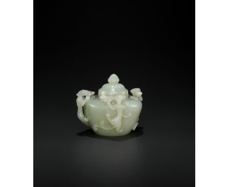 AN OPENWORK PALE CELADON JADE ‘CHILONG’ WATER POT AND COVER, QINGChina, 18th century. The rounded sides rising from the circu