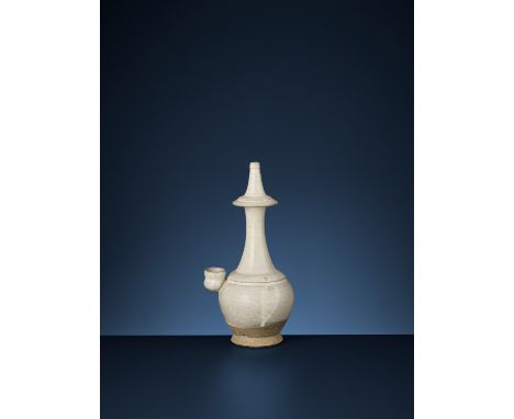 A WHITE-GLAZED KUNDIKA, TANG DYNASTYChina, 618-907. The globular body supported on a spreading foot, rising to a tall waisted