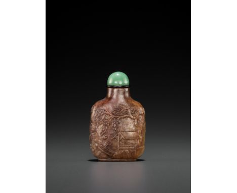 A RUSSET JADE SNUFF BOTTLE, ‘MASTER OF THE ROCKS’ SCHOOL, QING DYNASTYChina, 1740-1840. The opaque stone of a richly mottled 