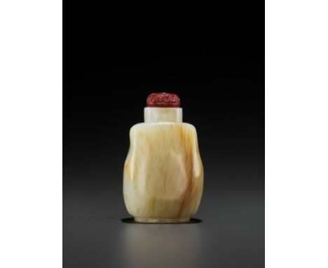 A WHITE AND RUSSET JADE SNUFF BOTTLE, QING DYNASTYChina, 1644-1912. Excellently hollowed through a small mouth and finely pol