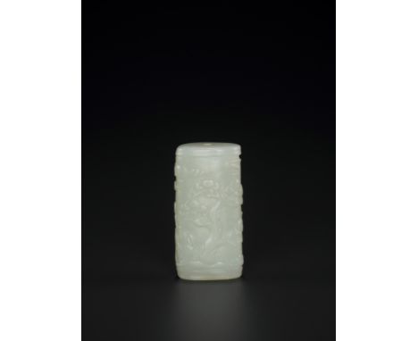 A WHITE JADE ‘PINE TREE’ BEAD, QING DYNASTYChina, 1644-1912. Of oval-cylindrical form, carved in relief with a pine tree unde