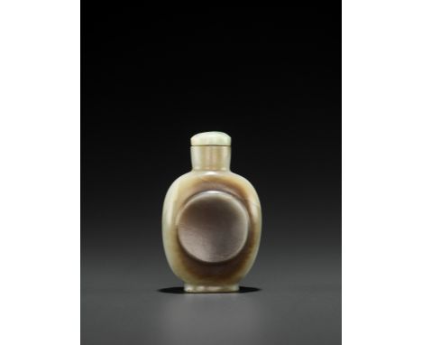 A CELADON JADE ‘INTEGRAL DISH’ SNUFF BOTTLE, QING DYNASTYChina, 18th century. Carved with a circular concave panel serving as