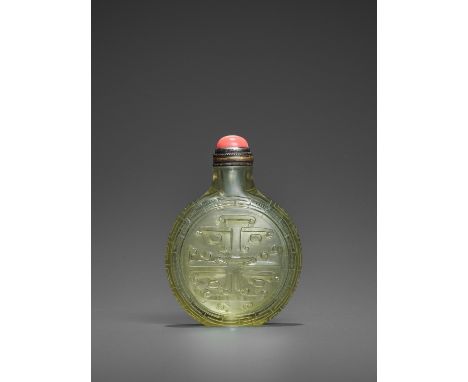 A TRANSPARENT OLIVE-GREEN GLASS ‘TAOTIE’ SNUFF BOTTLE, QING DYNASTYChina, 1720-1790. Imperial, attributed to the Palace Works