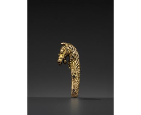 A GILT BRONZE ‘LONGMA’ HILT, MING DYNASTYChina, 1368-1644, Xuande period (1426-1435). Finely cast as a longma, a mythical cre