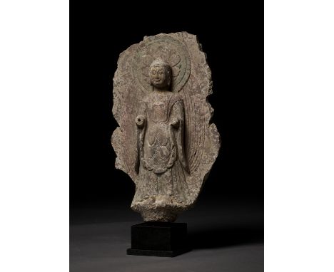 A STONE STELE OF BUDDHA SHAKYAMUNI, NORTHERN QIChina, 550-577. Depicted with an alluringly peaceful countenance, downcast eye