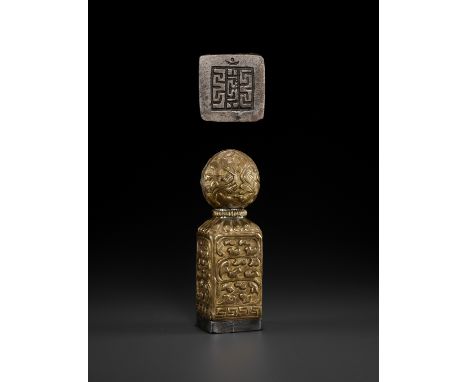 A LARGE TIBETAN-CHINESE COPPER REPOUSSE SEAL, MID-QING TO REPUBLICLate 18th to early 20th century. Of square shape with a sli
