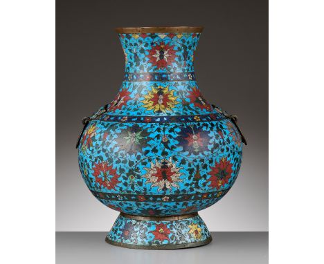 A VERY LARGE CLOISONNE HU, MING DYNASTYChina, 16th-17th century. The pear-shaped vase is finely enameled around the globular 