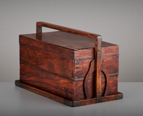 A HUANGHUALI TWO-TIER PICNIC BOX, TIHE, QING DYNASTYChina, 18th-19th century. Of rectangular shape, comprising a cover above 