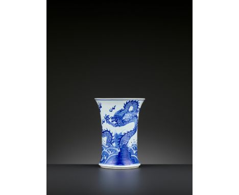 A BLUE AND WHITE ‘DRAGON AND GIANT CARP’ BRUSH POT, BITONG, QING DYNASTYChina, 1644-1912. Of waisted cylindrical form, painte