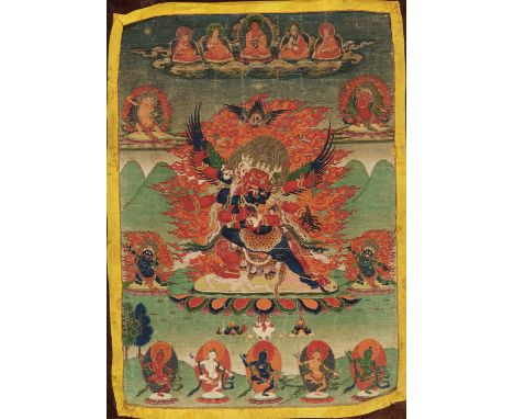 A THANGKA OF GURU DRAGPO, 18TH-19TH CENTURYTibet. Distemper and gold on cloth. The central figure with three heads, six arms,